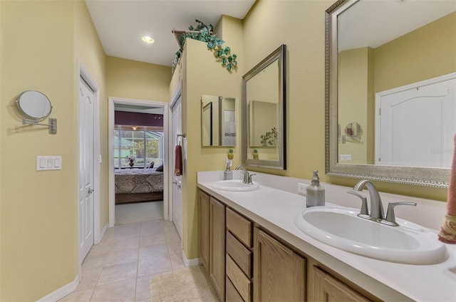 bathroom with tile patterned floors and vanity