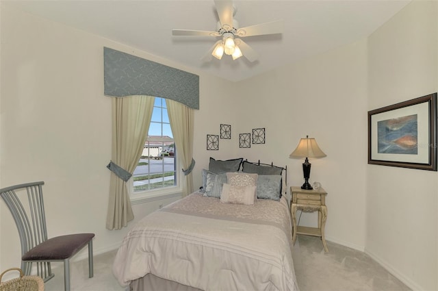 bedroom with ceiling fan and light carpet