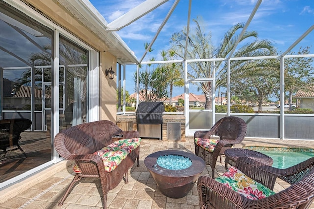 view of patio / terrace featuring a lanai and area for grilling