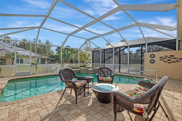 view of pool featuring a lanai, an in ground hot tub, and a patio