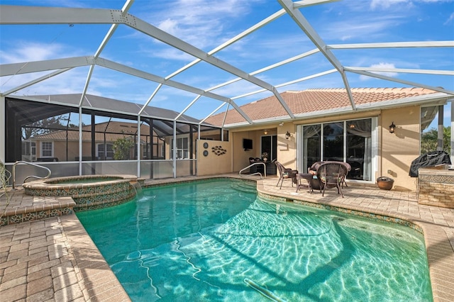 view of pool with a lanai, a patio, and an in ground hot tub