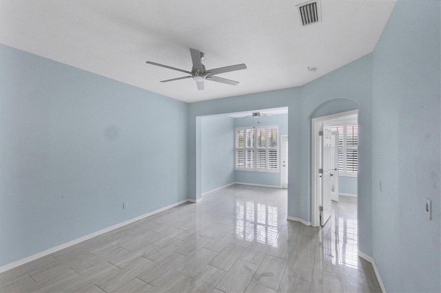 spare room with ceiling fan