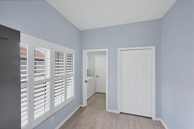 corridor with washer and dryer