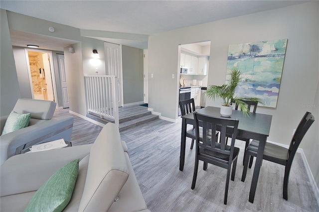 dining area featuring wood-type flooring