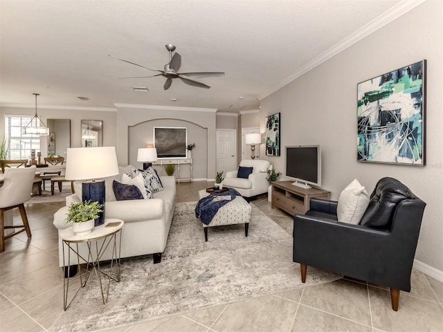 tiled living room featuring crown molding and ceiling fan