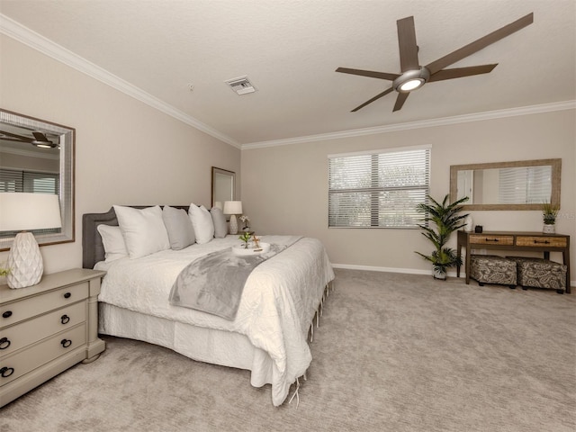 carpeted bedroom featuring crown molding and ceiling fan