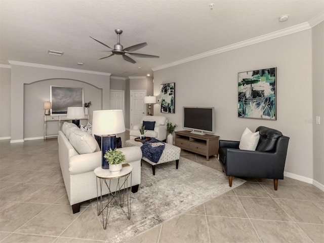 living room featuring crown molding, ceiling fan, and light tile patterned flooring