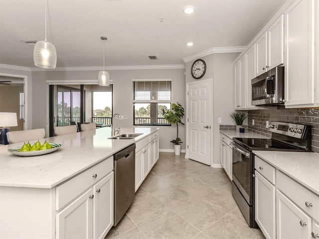 kitchen with pendant lighting, an island with sink, sink, light stone counters, and stainless steel appliances