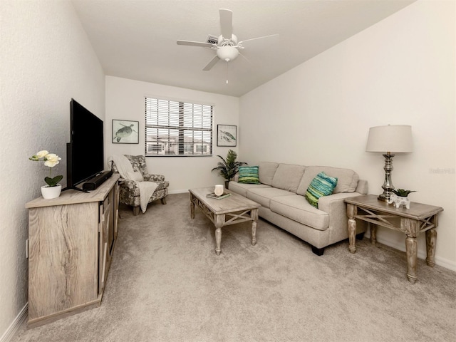 living room with light carpet and ceiling fan