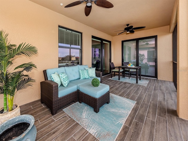 exterior space with ceiling fan and an outdoor hangout area