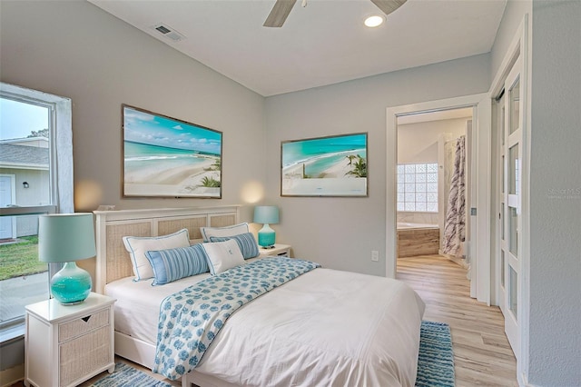 bedroom with ceiling fan and light hardwood / wood-style floors