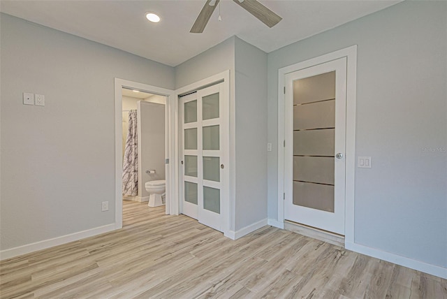 spare room with ceiling fan and light hardwood / wood-style floors