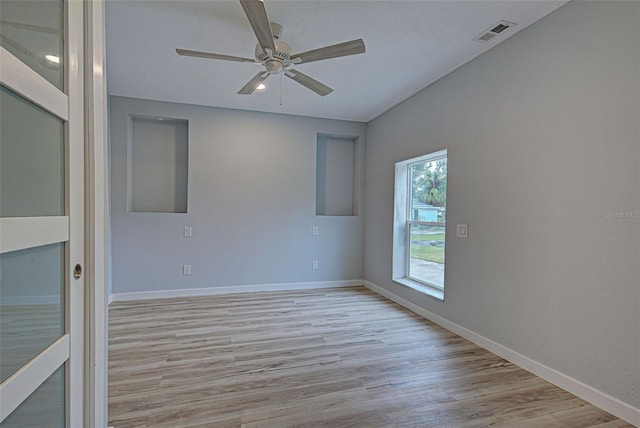 unfurnished room featuring ceiling fan and light hardwood / wood-style floors