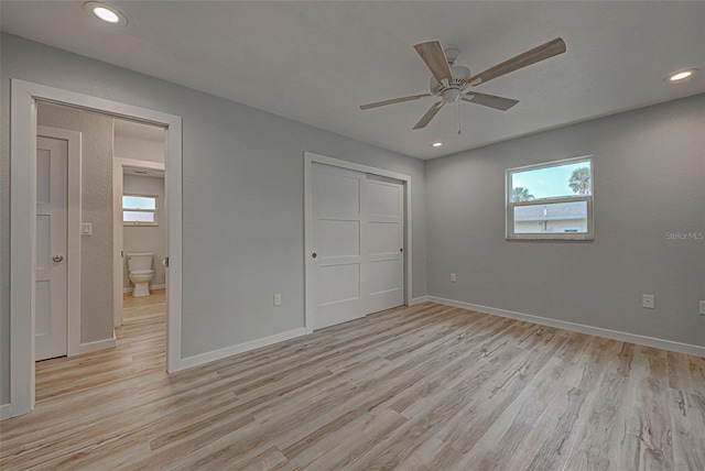 unfurnished bedroom featuring a closet, ceiling fan, and light wood-type flooring