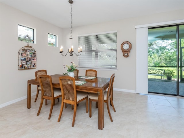 tiled dining space with a notable chandelier