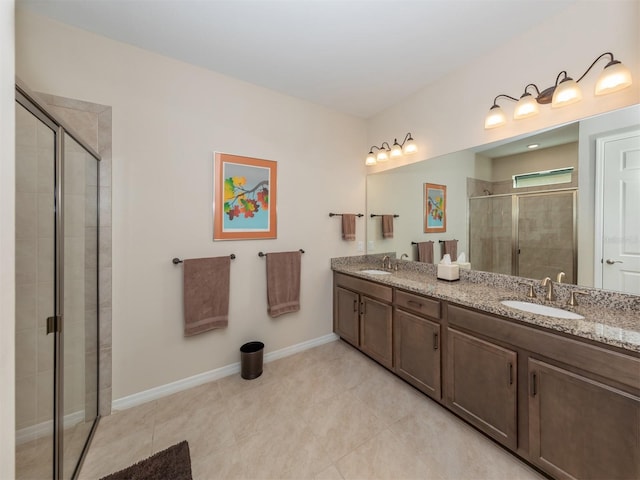 bathroom featuring walk in shower, vanity, and tile patterned floors