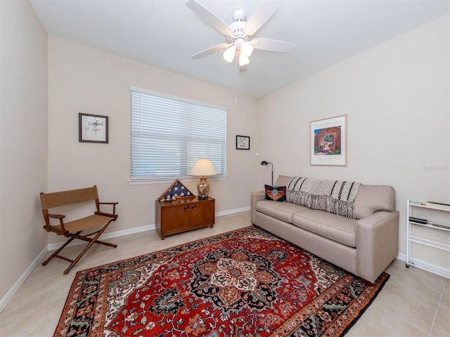 living room with ceiling fan and light tile patterned floors