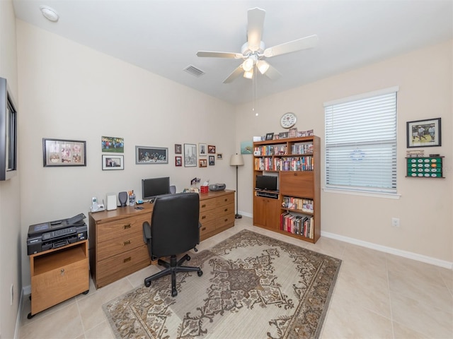 tiled office space with ceiling fan