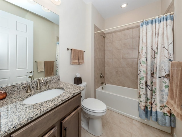 full bathroom featuring tile patterned flooring, toilet, vanity, and shower / bath combination with curtain