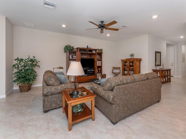 living room with ceiling fan and light tile patterned floors