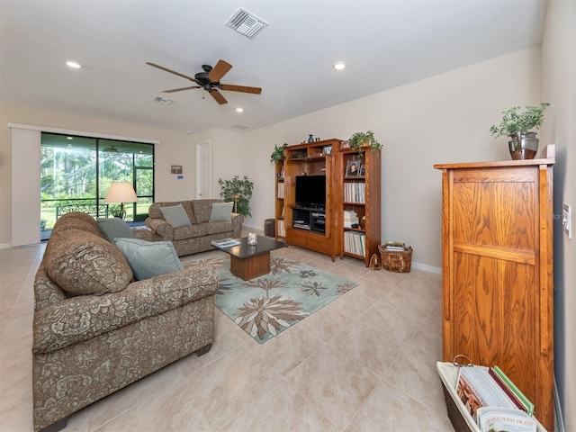 tiled living room with ceiling fan