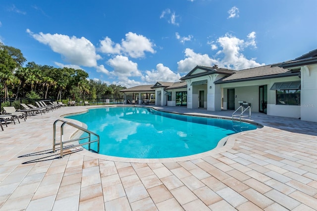 view of swimming pool with a patio area