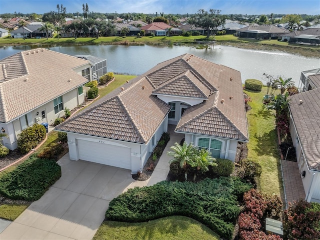 birds eye view of property with a water view