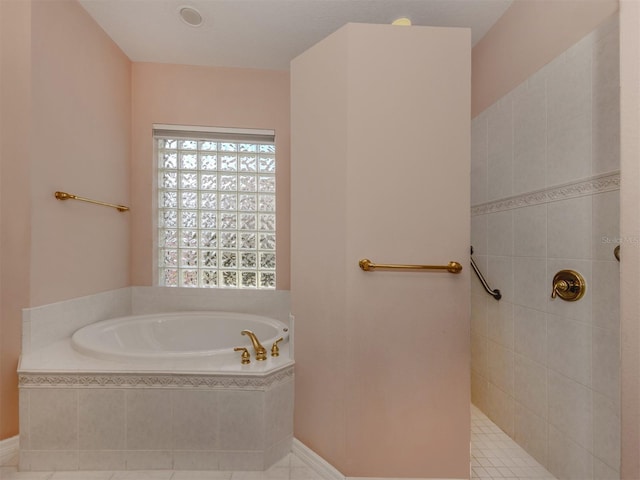 bathroom featuring tiled bath