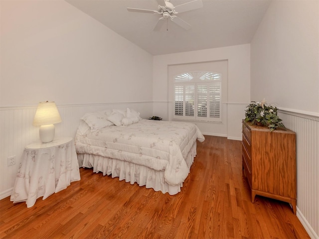 bedroom with ceiling fan and hardwood / wood-style floors