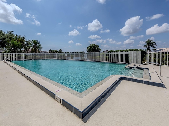 view of swimming pool with a patio