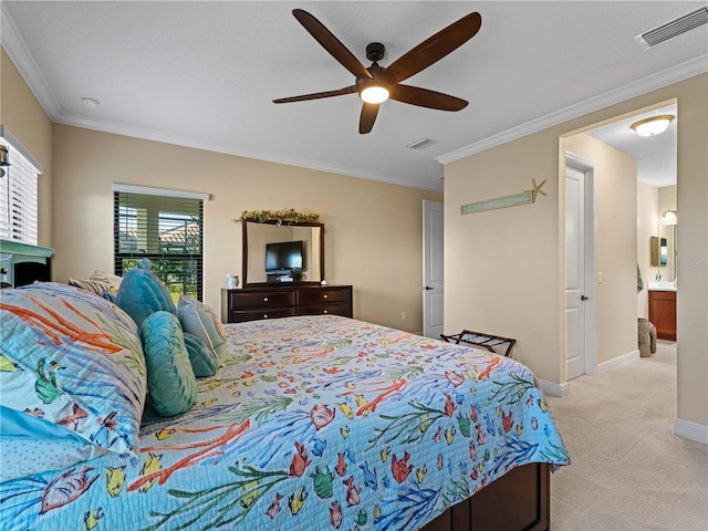 carpeted bedroom with ceiling fan and ornamental molding