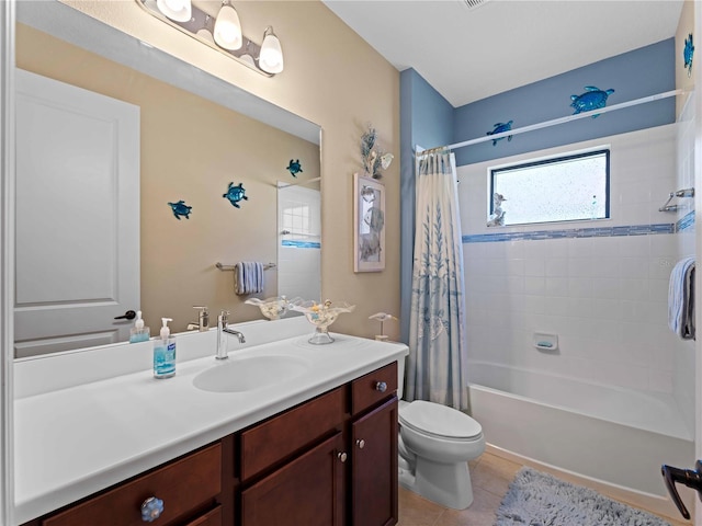 full bathroom with vanity, tile patterned floors, toilet, and shower / bath combo with shower curtain