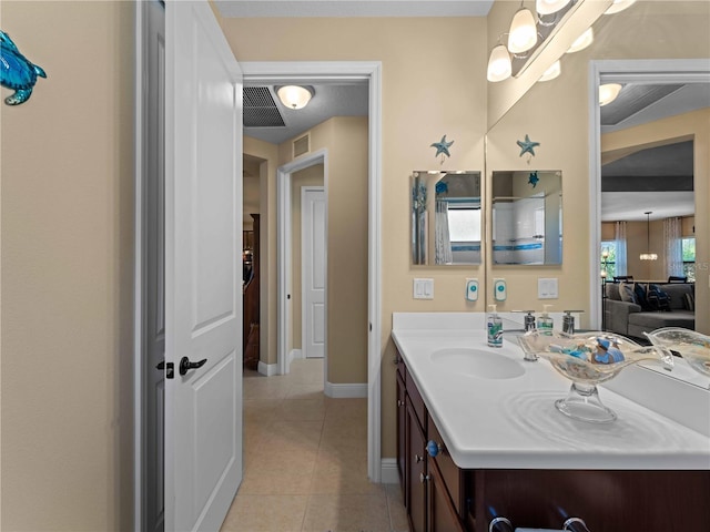 bathroom with tile patterned floors and vanity