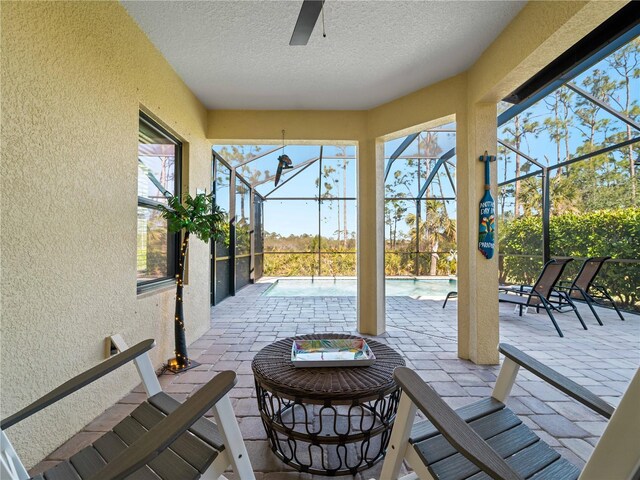 view of patio / terrace with glass enclosure