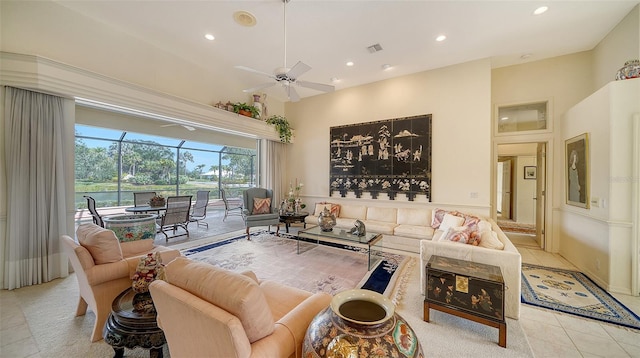 tiled living room featuring ceiling fan