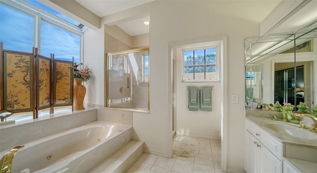 bathroom featuring vanity, independent shower and bath, and tile patterned flooring