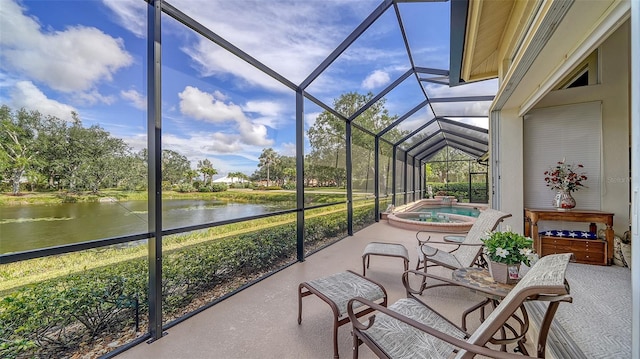 sunroom featuring a water view