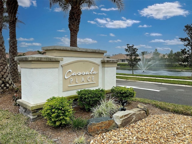 community sign with a water view