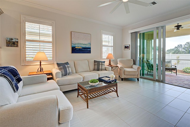 tiled living room featuring ornamental molding and ceiling fan