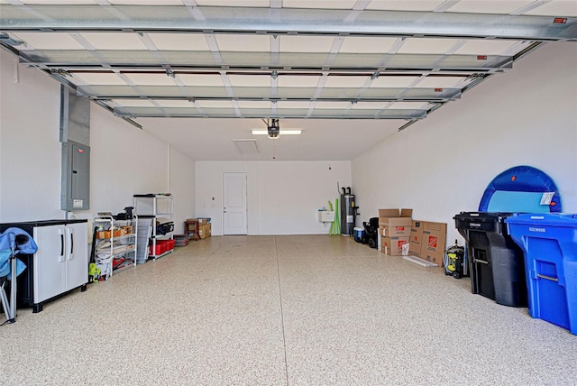 garage featuring electric water heater and electric panel