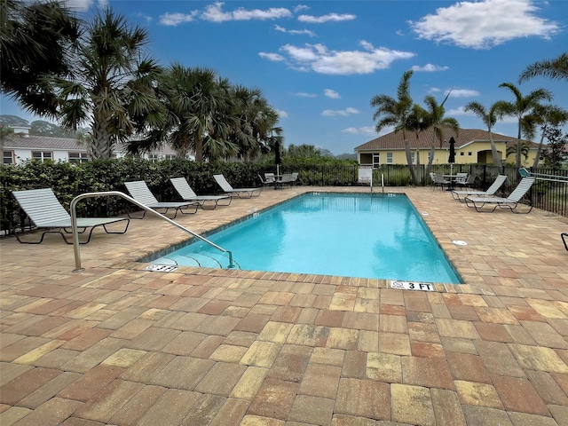 view of swimming pool with a patio