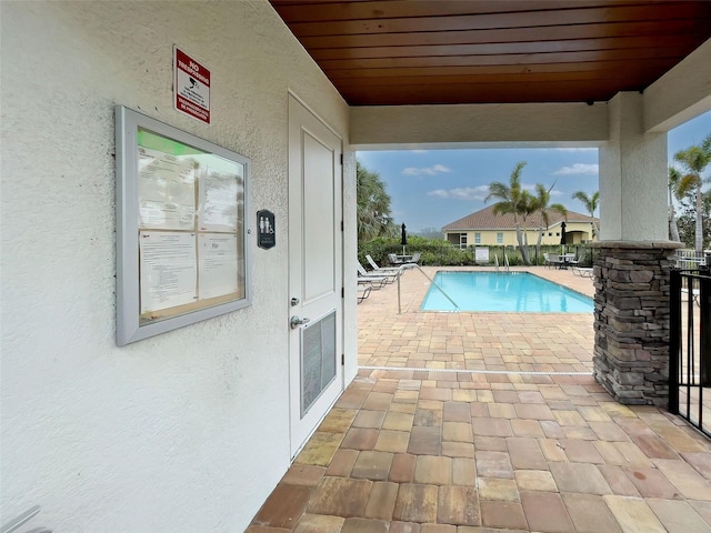 view of pool featuring a patio area