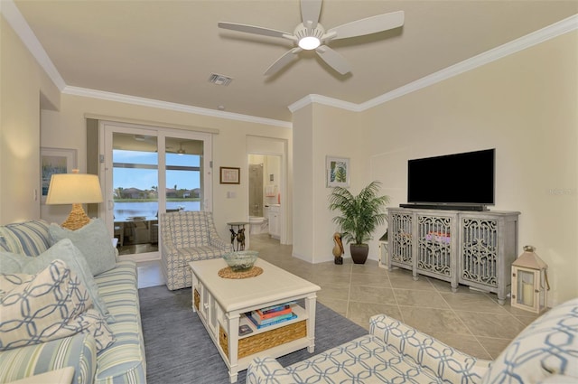 tiled living room with crown molding and ceiling fan