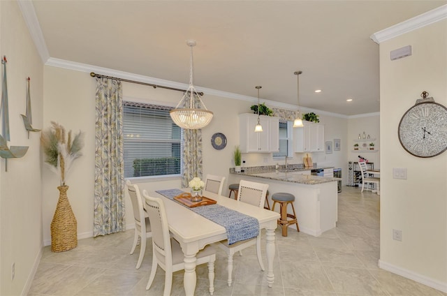 tiled dining room with ornamental molding and sink