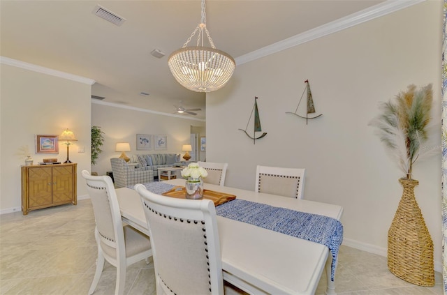 dining space with light tile patterned floors, crown molding, and a chandelier