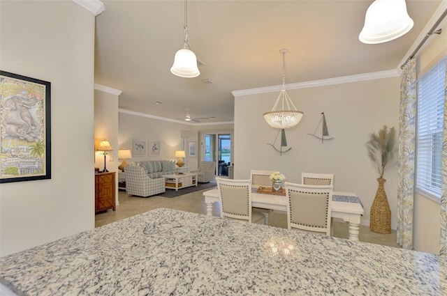 dining room featuring ornamental molding and light tile patterned floors