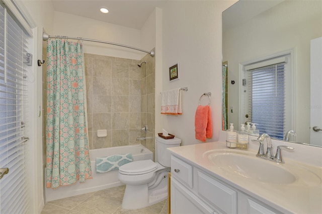 full bathroom with tile patterned floors, toilet, vanity, and shower / bath combo