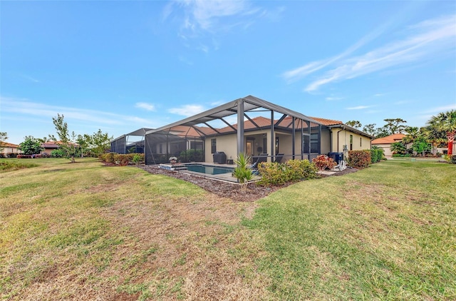 back of property featuring a yard and glass enclosure