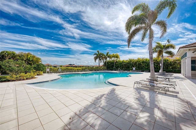 view of swimming pool with a patio area