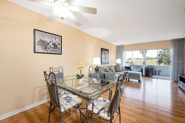 dining space featuring ceiling fan and light hardwood / wood-style floors